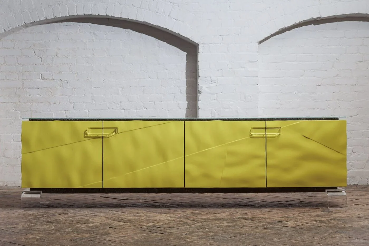 Solis — yellow lacquer sideboard with rasped concrete body and thermoformed Perspex legs, Sterox Studio