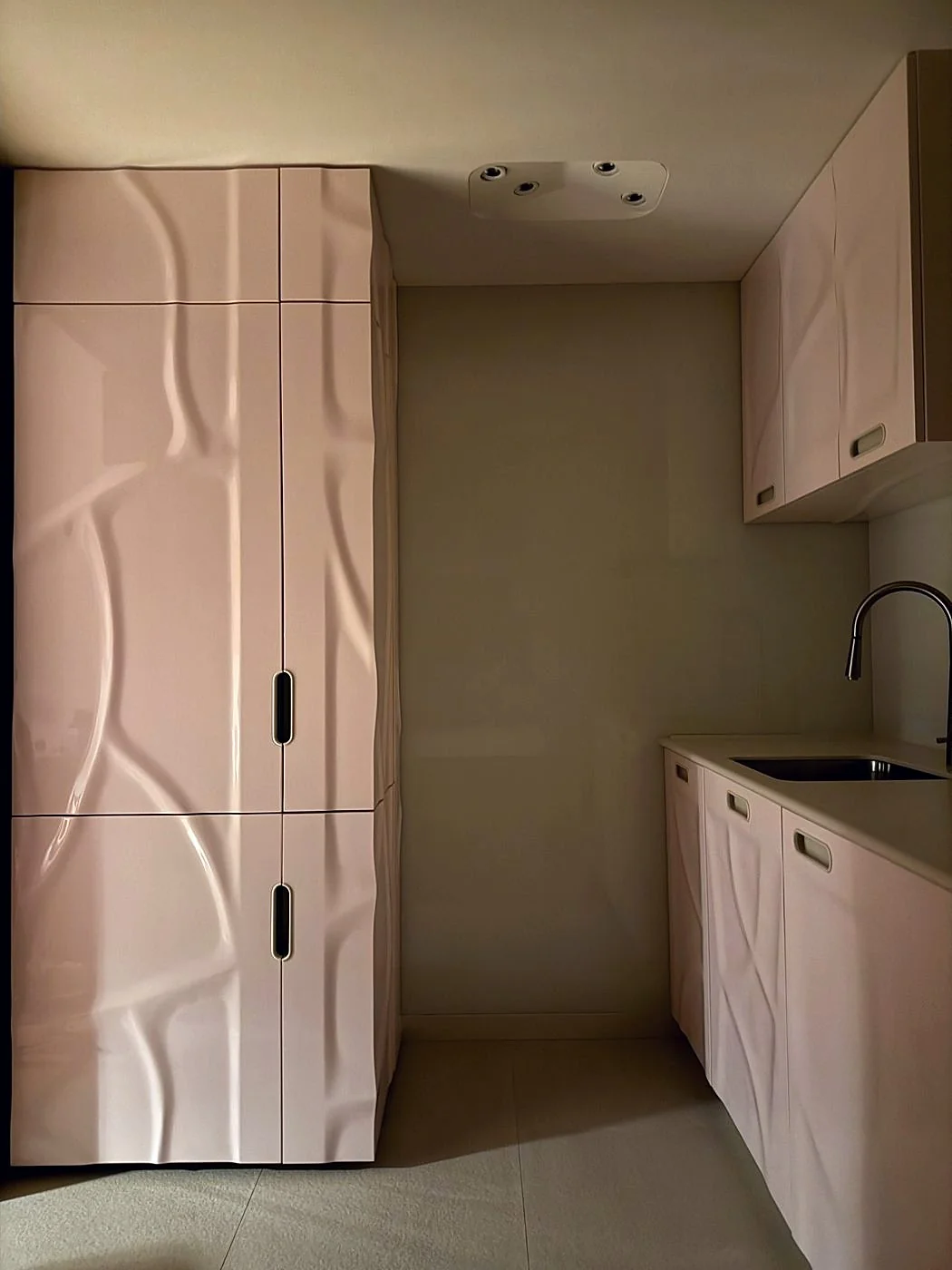 Blush high-gloss pink lacquer kitchen with hand-shaped organic panels, Sterox Studio London